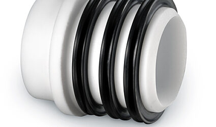 Sleeve-style shaft seal for rotary airlock valves
