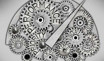 Gears and machine parts with words related to efficiency