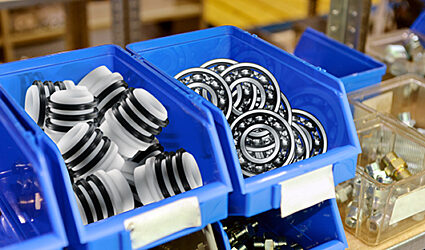 Blue bins filled with spare parts