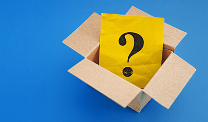 A yellow envelope with a question mark on the cover inside a box