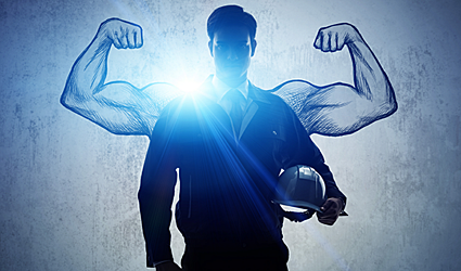 Worker with a hard-hat and uniform with cartoon muscle arms drawn in the background