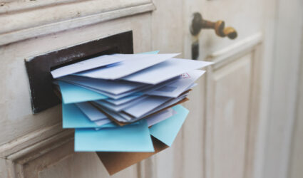 Mail Slot full of Letters