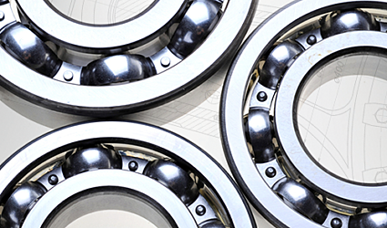 Three rotary valve bearings on a background of white schematics