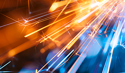 Abstract New Years Eve fireworks and sparks in orange and blue