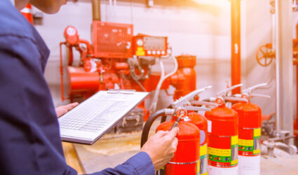 Inspector checking for fire safety and NFPA compliance