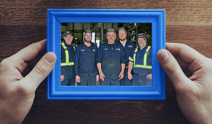 A framed image of ACS Valves teammates who work on the shop floor