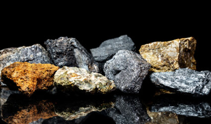 An assortment of mineral ores on a black background