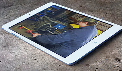 Tablet with video image of a technician assembling a rotary airlock valve.