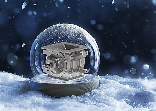 A rotary valve inside a snow globe in a snowy landscape