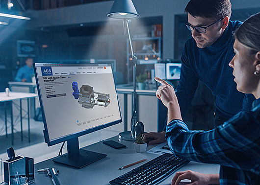 Two technical specialists looking at a screen with the Quick-Clean with RotorRail Valve