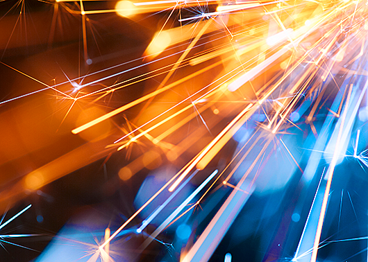 Abstract New Years Eve fireworks and sparks in orange and blue