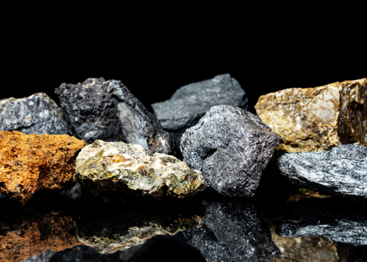 An assortment of mineral ores on a black background