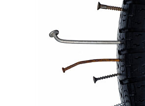 ACS Leaks Blog Image - Tire with Nails and Screws