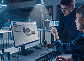 Two technical specialists looking at a screen with the Quick-Clean with RotorRail Valve