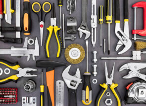 Variety of tools including wrench, screwdriver, hammer, pliers and tape measure