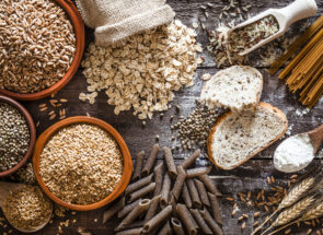 Grains, seeds, bread and pasta on a wooden table