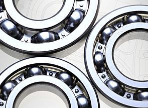Three rotary valve bearings on a background of white schematics