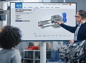 Presenter pointing to a screen with a 3D image of a Quick-Clean rotary valve