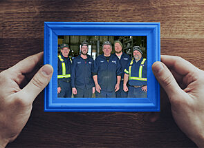 A framed image of ACS Valves teammates who work on the shop floor
